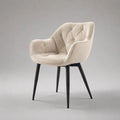 Sedia da pranzo imbottita in tessuto beige con braccioli, schienale curvo e gambe in acciaio nero, 63 x 61 x 84 cm
